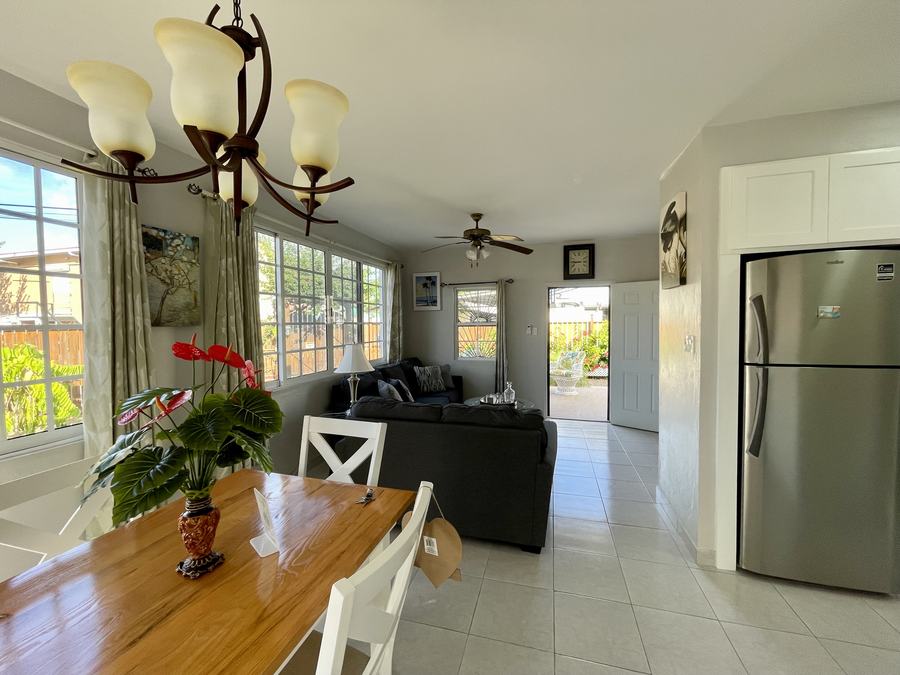 Bright open-plan dining and living area at Haven